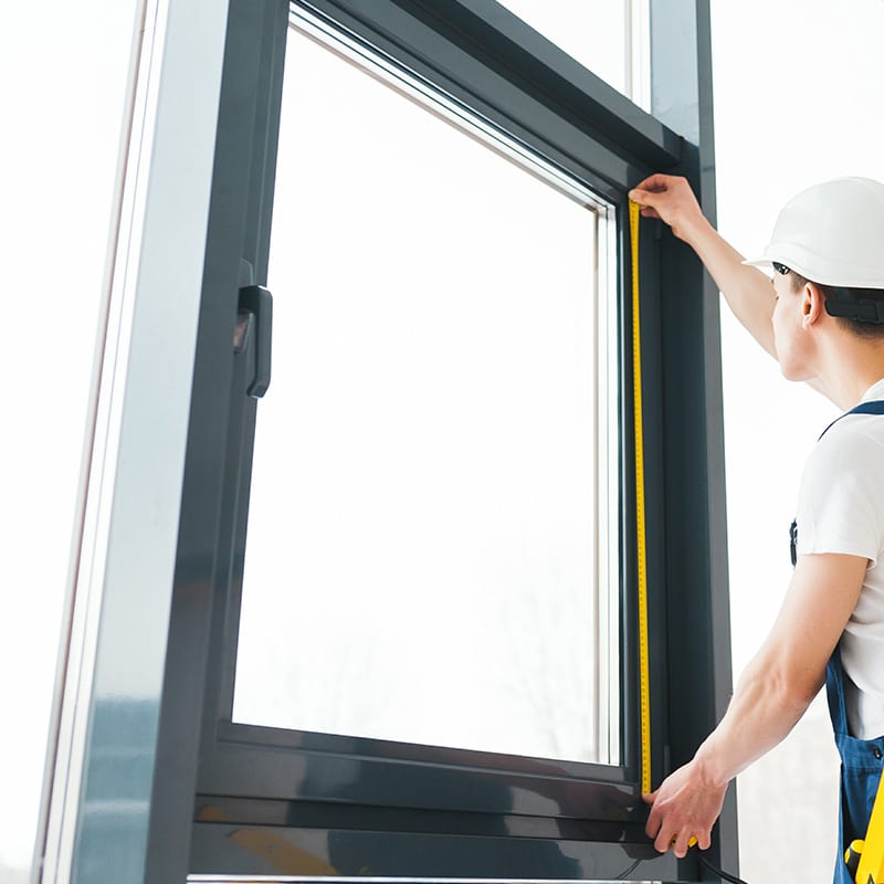 Man measuring a window