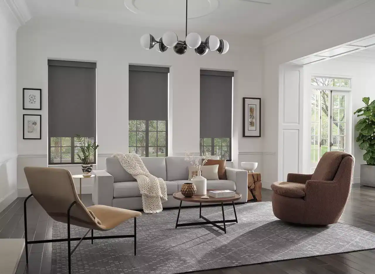 Bright and airy living space featuring neutral decor, large windows, cozy seating, and contemporary accents. Ideal for relaxation and social gatherings.