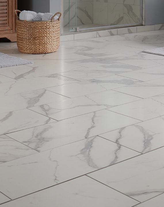 Luxurious marble bathroom floor tiles with gray veining, ideal for modern and elegant bathroom designs. Durable, easy to clean, and adds a sophisticated touch to any bathroom space.