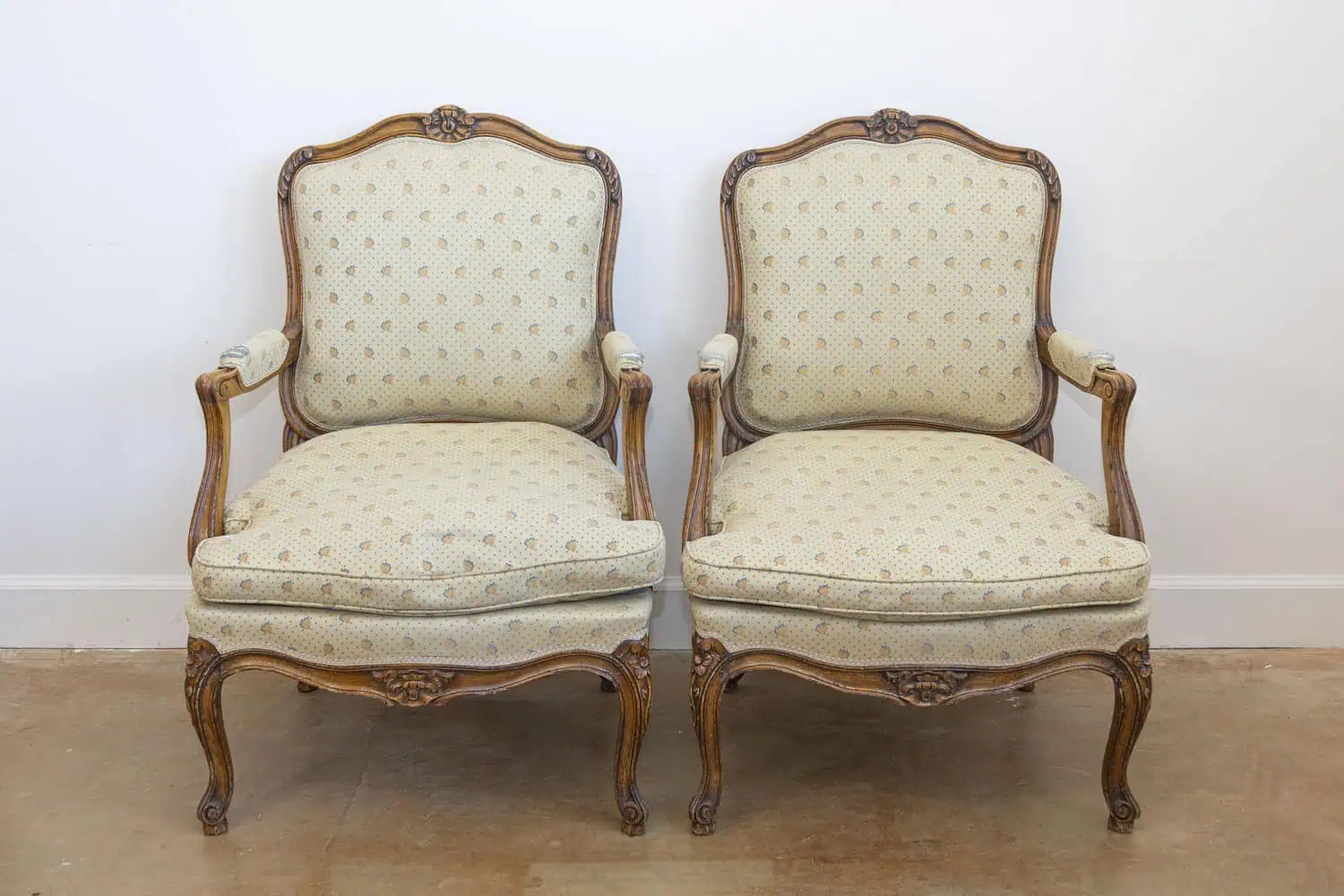 Louis XV Style French Walnut Fauteuils à la Reine with Carved Floral Motifs - JAA