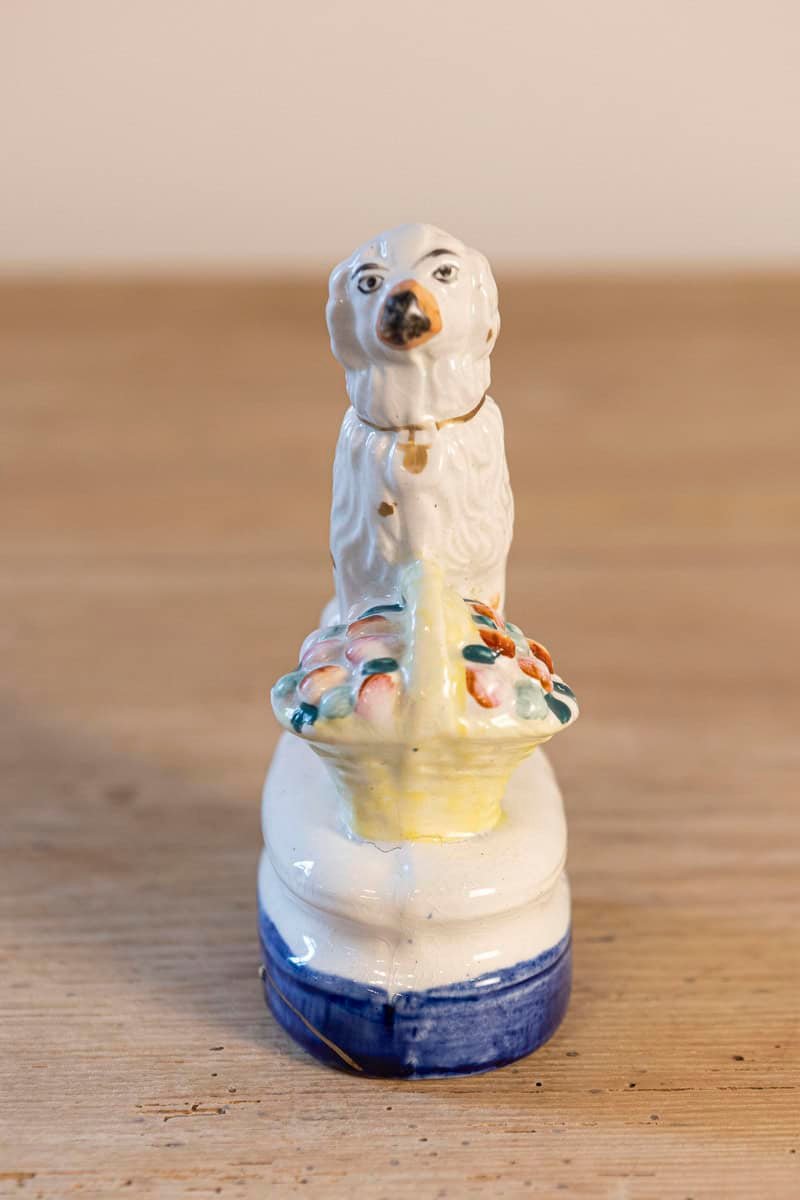 Petite English Michael Davis Porcelain Dog with Fruit Basket and Blue Oval Base - JAA