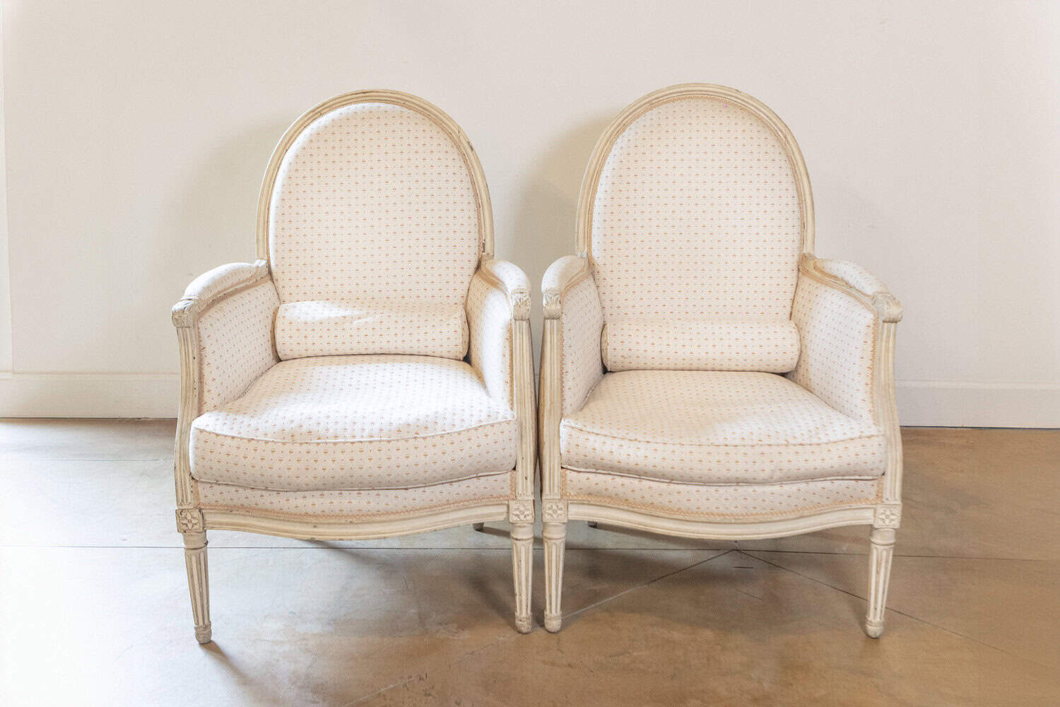 Pair of French Louis XVI Style Painted Bergères Chairs with Oval Shaped Backs - JAA