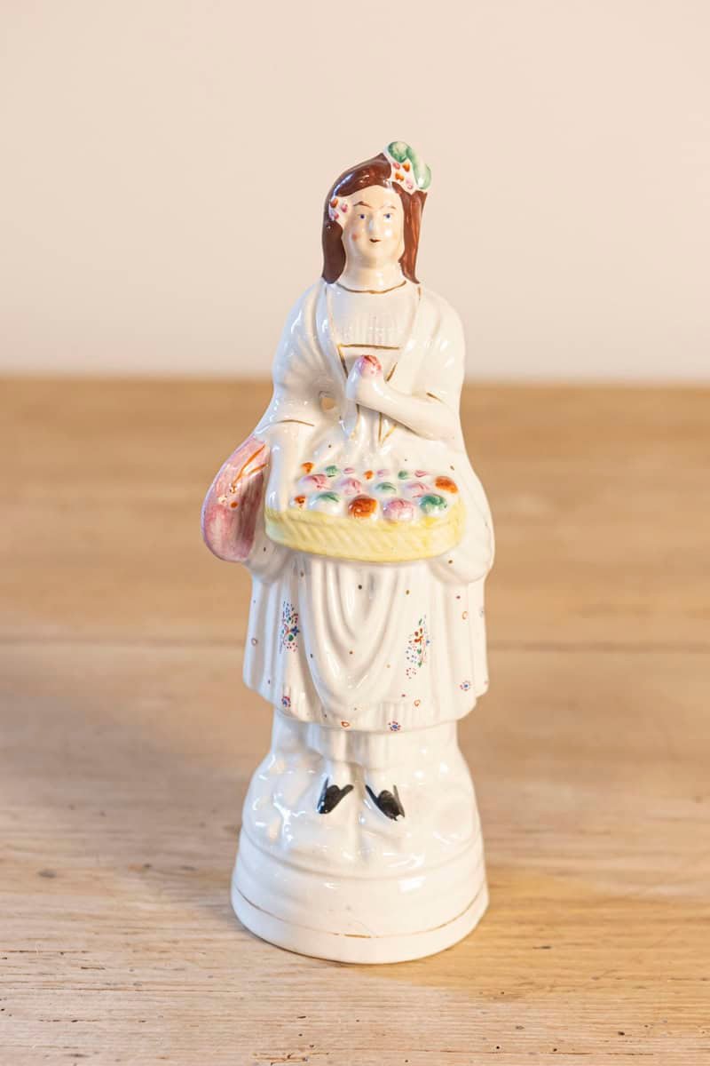 Petite English Porcelain Decorative Object Depicting a Lady with a Floral Basket - JAA