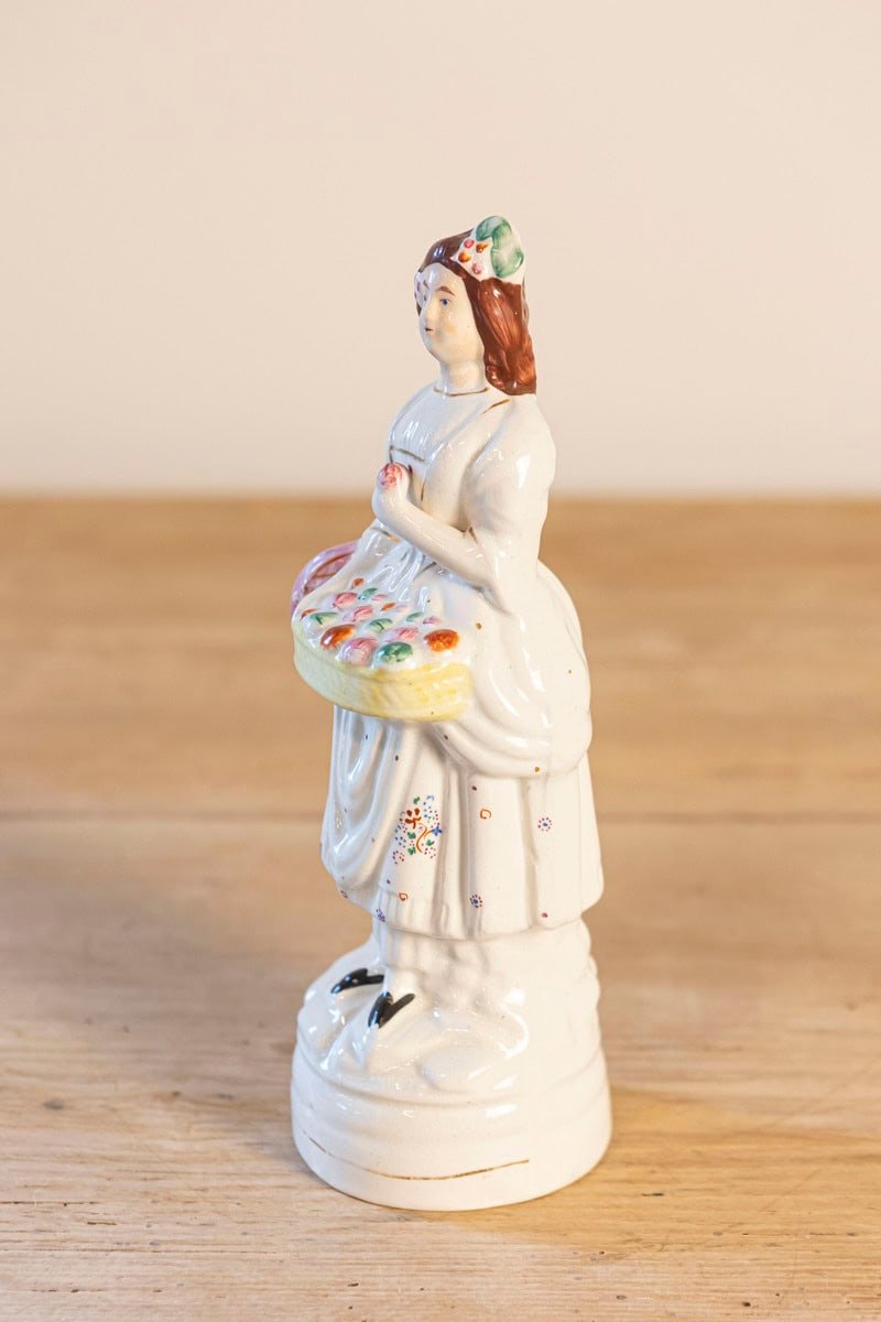 Petite English Porcelain Decorative Object Depicting a Lady with a Floral Basket - JAA