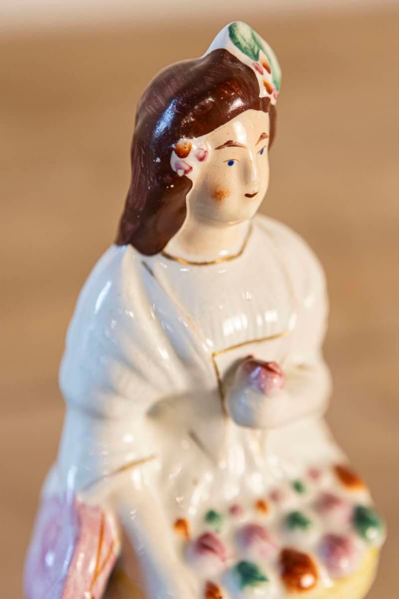 Petite English Porcelain Decorative Object Depicting a Lady with a Floral Basket - JAA