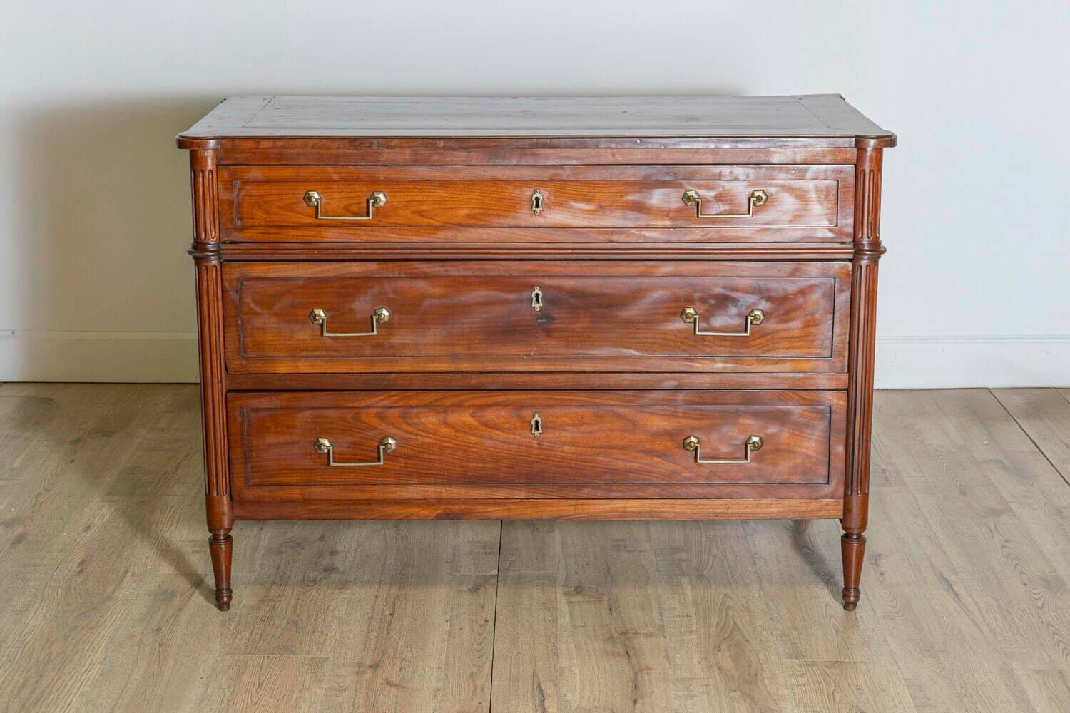 French Louis XVI Style 19th Century Cherry Three-Drawer Commode with Fluting - JAA