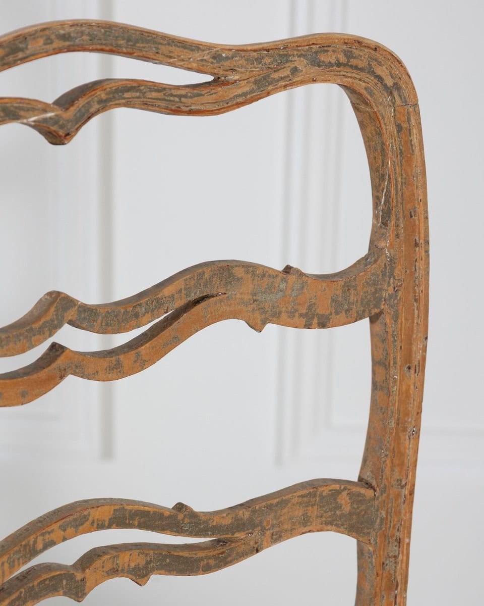 A pair of slender Gustavian chairs with smiling details, scraped to original paint and newly covered in linen. Circa 1780 - JAA