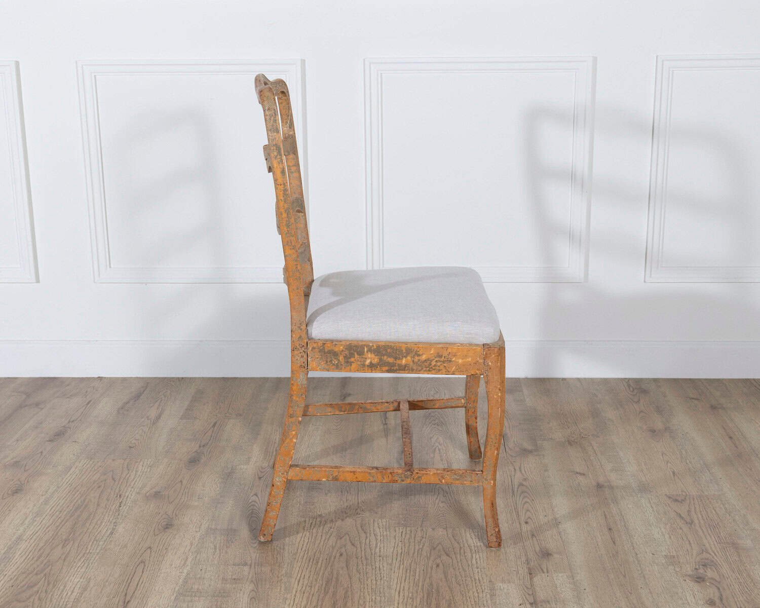A pair of slender Gustavian chairs with smiling details, scraped to original paint and newly covered in linen. Circa 1780 - JAA