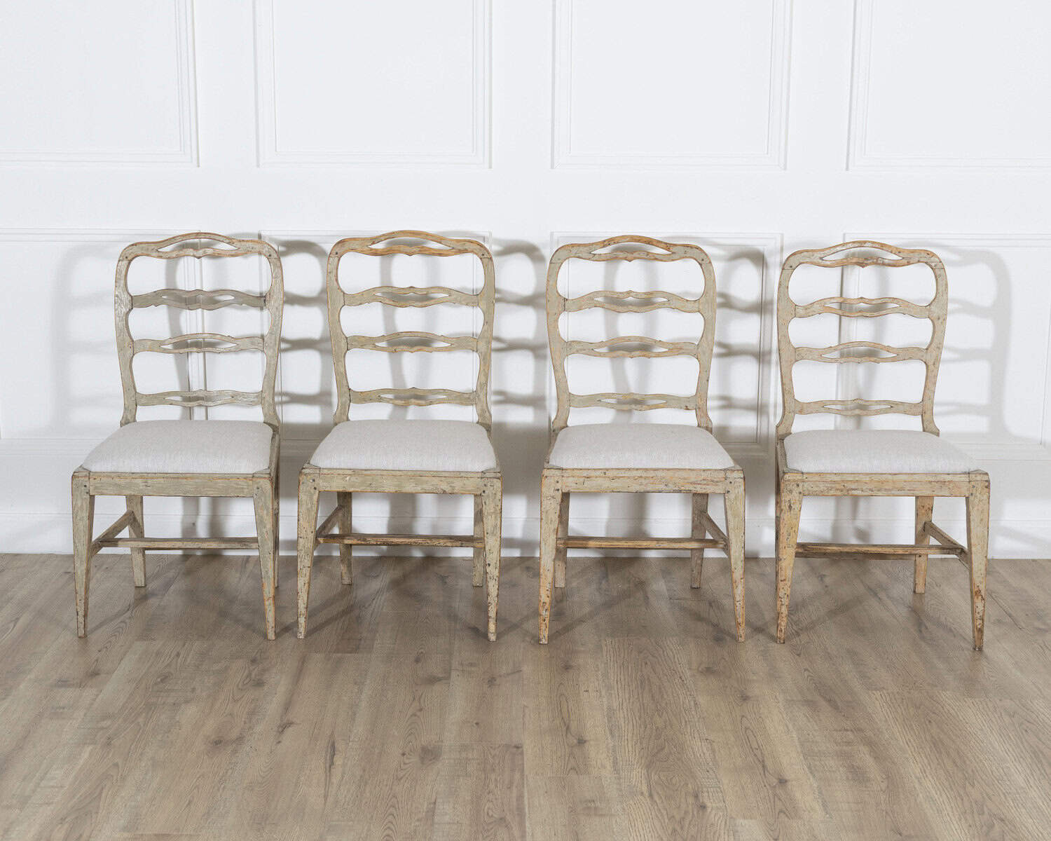 ON TRIAL - A set of four period Gustavian chairs scraped to original paint and newly covered in linen - JAA