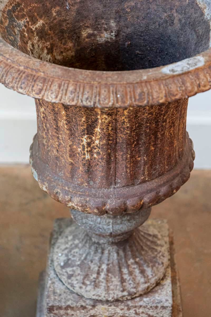 Pair of French 19th Century Iron Médicis Vases on Stepped Pedestals with Patina - JAA