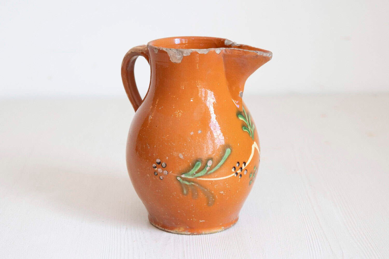 French 19th Century Redware Floral Pitcher with Orange, Cream and Green Glaze - JAA