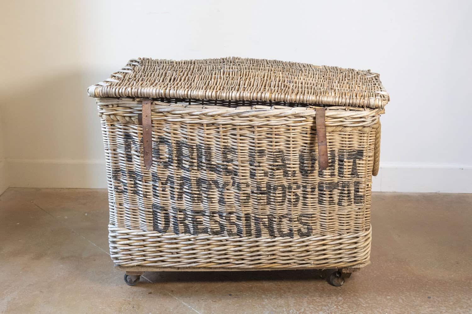Early 20th Century English Wicker Laundry Basket on Wheels with Stenciled Labeling - JAA