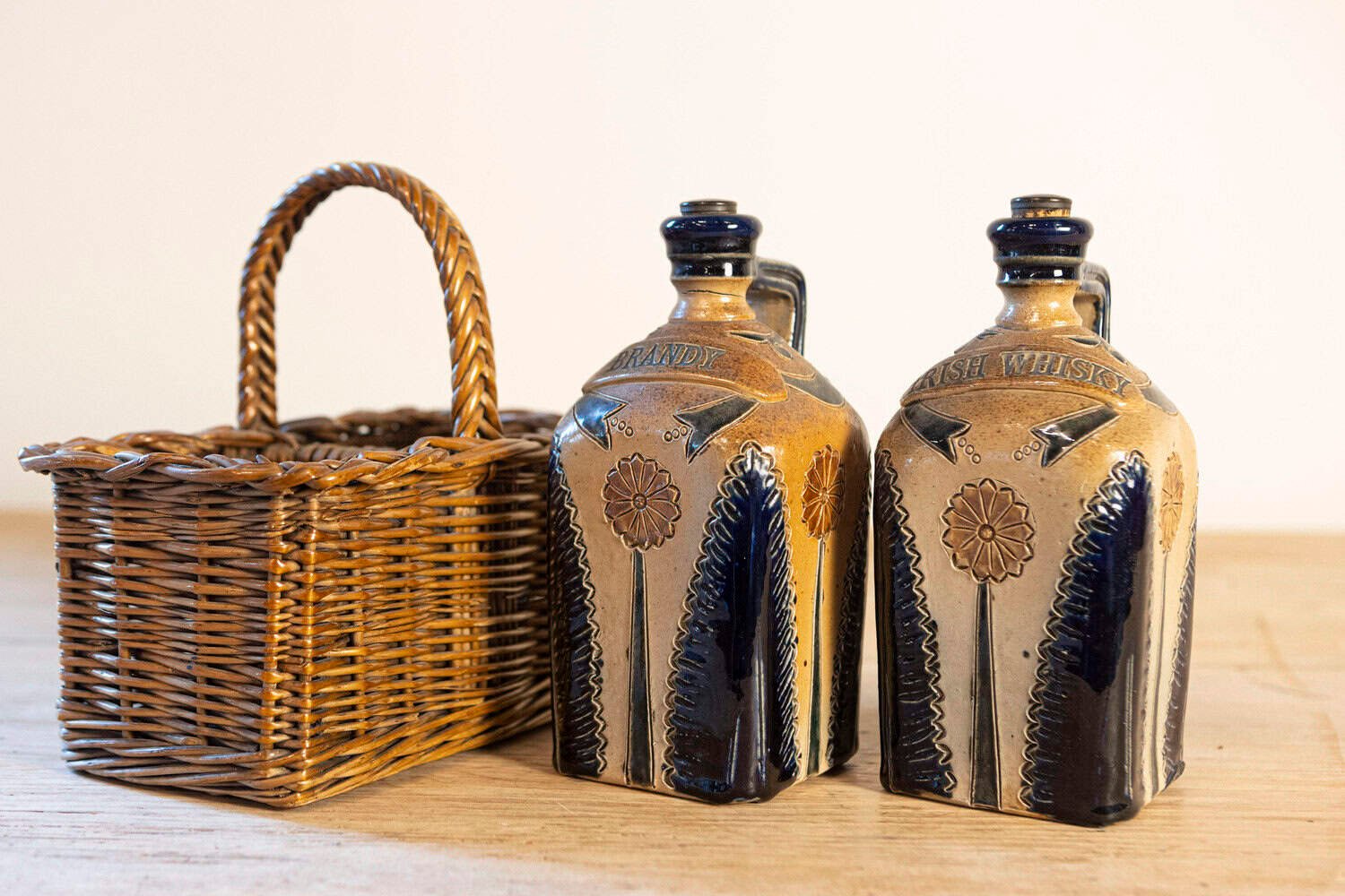 Two Victorian English Pottery Decanters in Tantalus-Inspired Wicker Basket - JAA