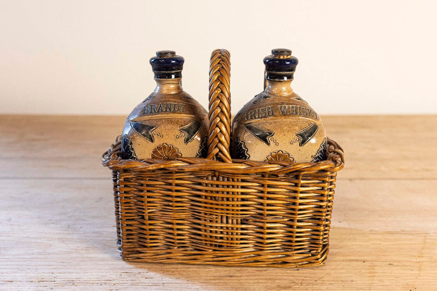 Two Victorian English Pottery Decanters in Tantalus-Inspired Wicker Basket - JAA