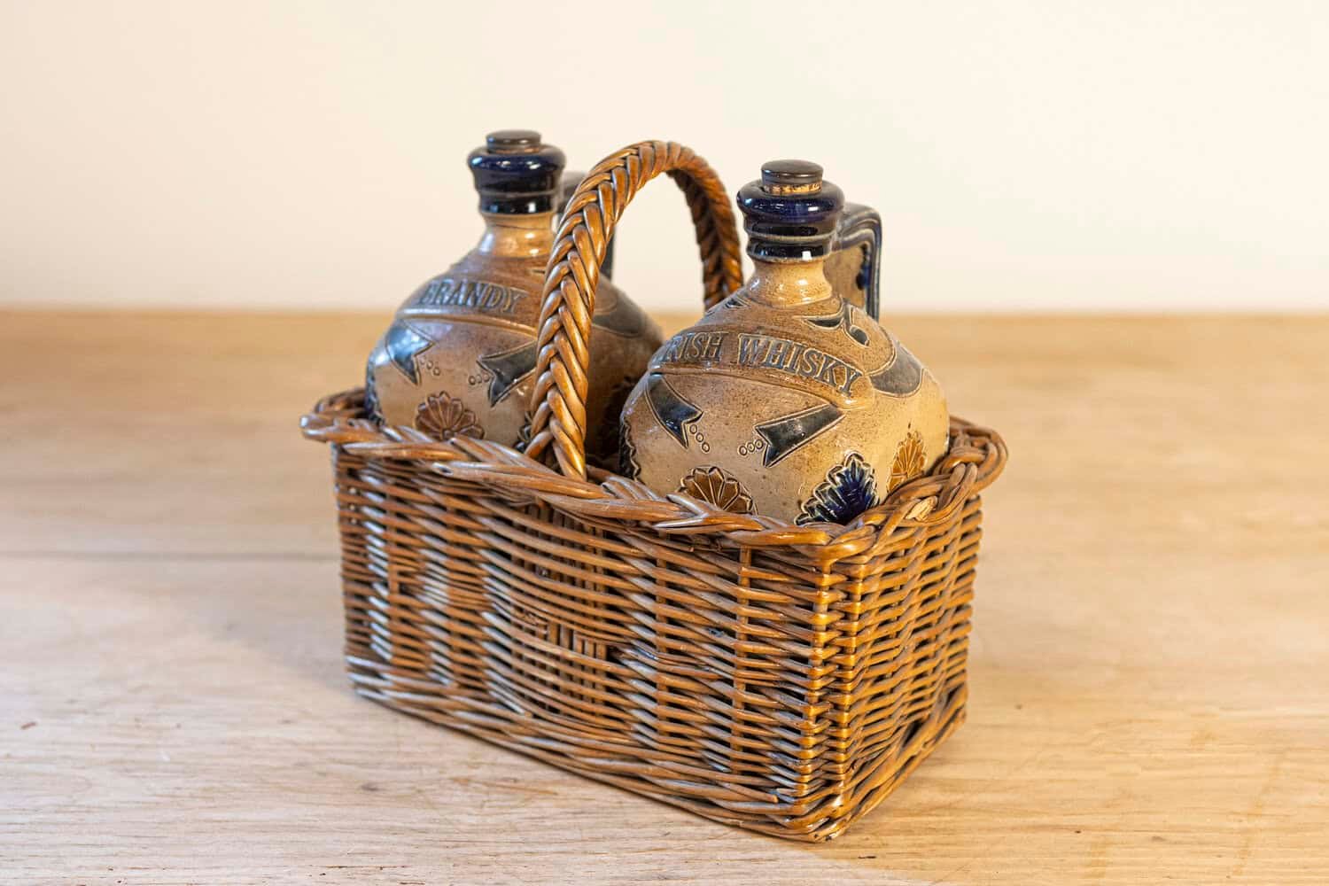 Two Victorian English Pottery Decanters in Tantalus-Inspired Wicker Basket - JAA