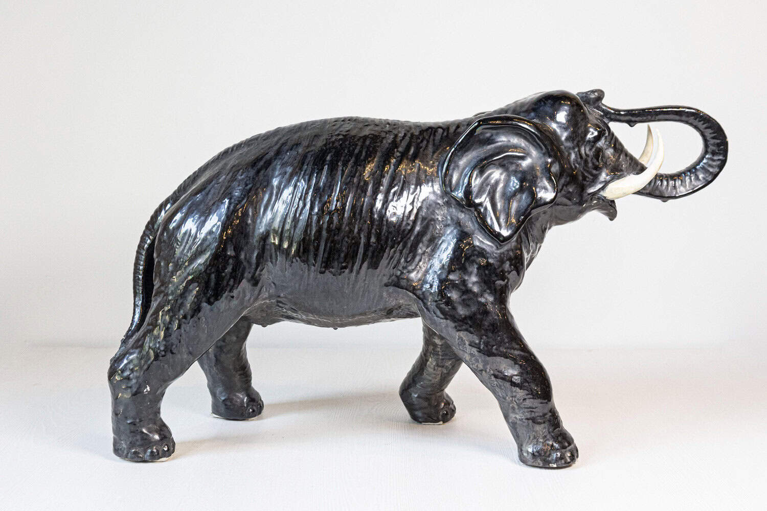 Vintage Italian Black Glazed Ceramic Sculpture of a Walking Elephant, Trunk Up - JAA