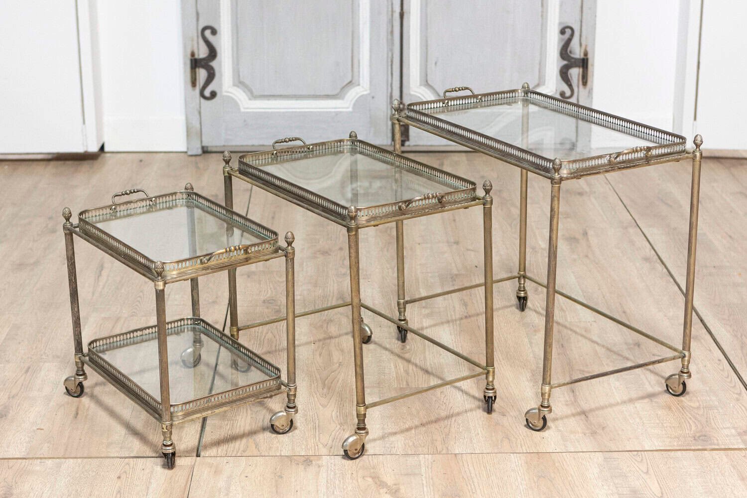 Set of Three French Neoclassical Style Nesting Bar Carts with Glass Shelves - JAA