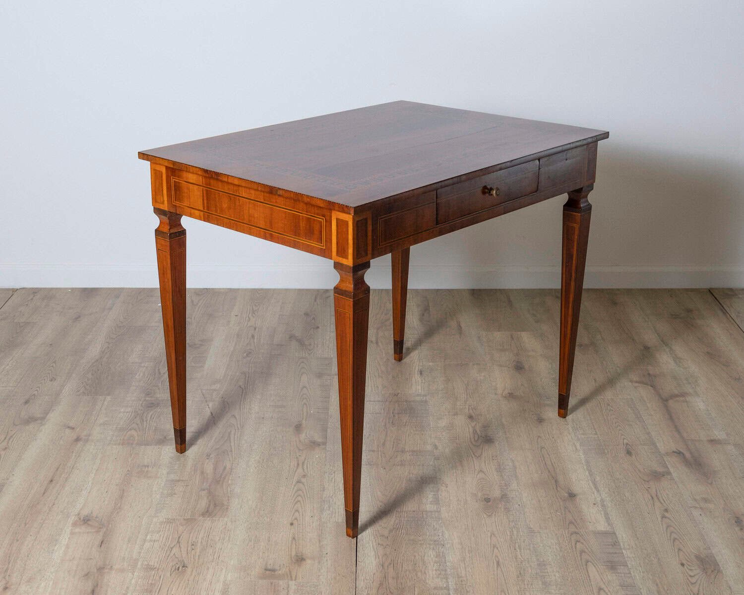 A very elegant walnut table/desk with a central drawer - JAA