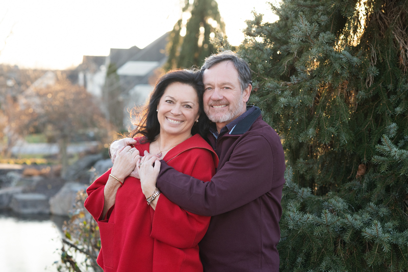 grandparents couples picture in front of trees