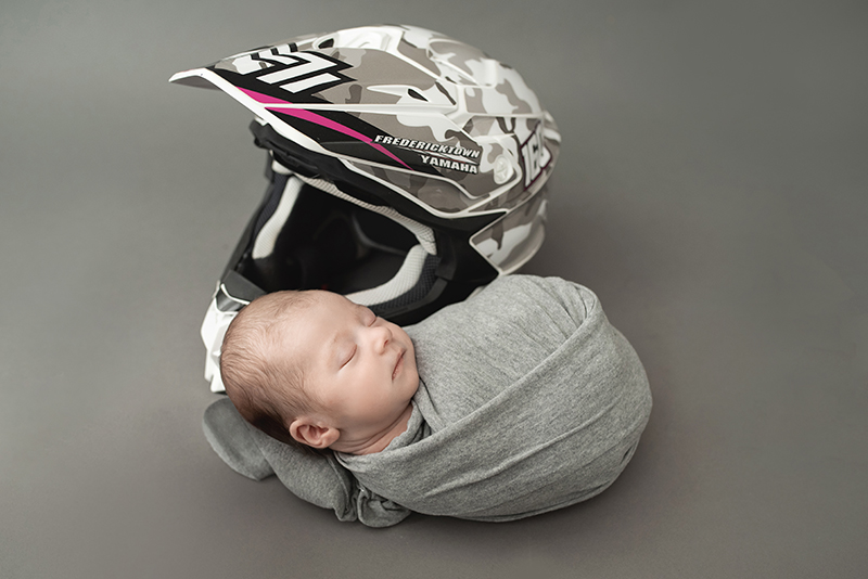 motocross dad newborn photo with helmet