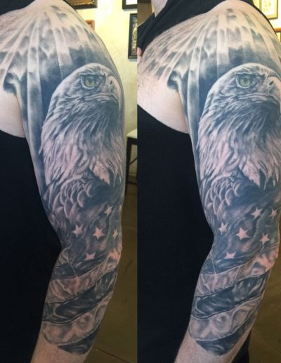Jesse Britten Tattoo, St. Augustine, FL, black and grey - Eagle and American flag black and grey tattoo on arm.