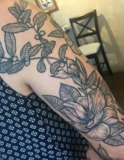 Jesse Britten Tattoo, St Augustine FL,. Floral tattoo sleeve featuring mistletoe and a magnolia flower.
