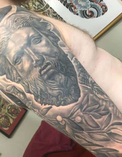 black and white tattoo - Celtic statue tattoo, statue tattoo, mistletoe tattoo realistic tattoo, realism, realistic tattoo artist