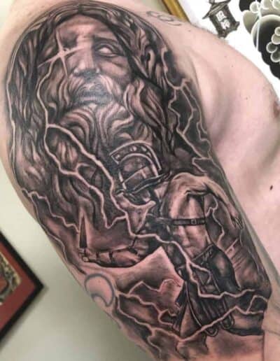 Jesse Britten Tattoo, St. Augustine, FL, black and grey - Tattoo of Zeus and a gladiator with lightning bolts.