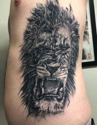 lion tattoo , black and grey , statue tattoo , St Augustine tattoo artist
