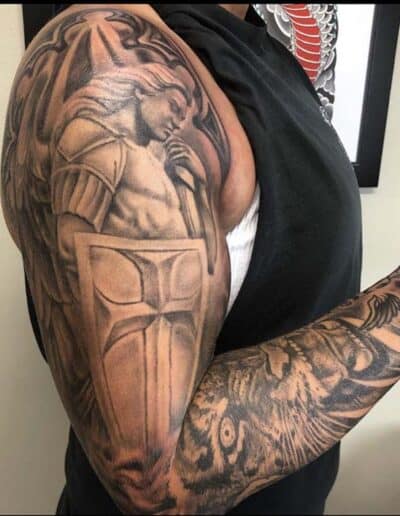 Jesse Britten Tattoo, St. Augustine, FL Jesse Britten tattoo on arm with angel, sword, and shield