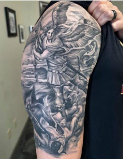 Detailed black and gray warrior tattoo on arm in St Augustine, Florida.