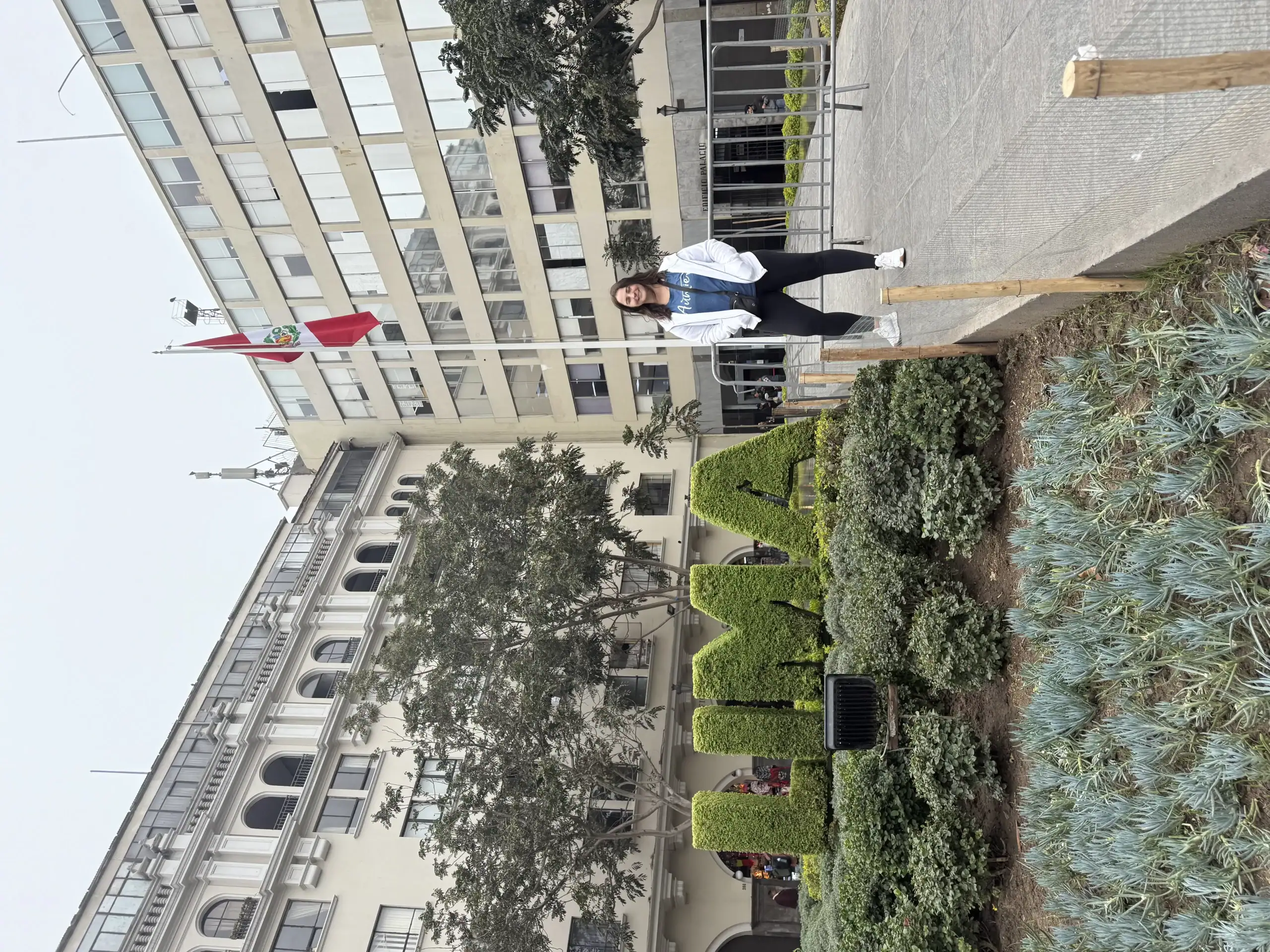 Peru travel destination, woman sightseeing in Lima, urban travel in Lima, exploring Peru's capital city, travel photography in Lima, travel blogger visiting Lima, Girl standing in front of "LIMA" sign, Lima travel adventure.