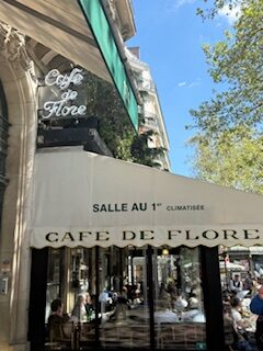 Cozy outdoor seating at Café de Flore in Paris, a historic and iconic spot for coffee lovers and tourists exploring the charming streets of the city.