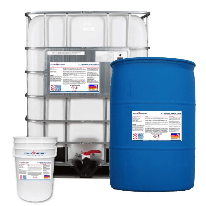 Three containers of varying sizes labeled "ALUMINUM-BRIGHTENER_product" with hazard identification signs: a small bucket, a large blue drum, and a white ibc tote of aluminum cleaner.