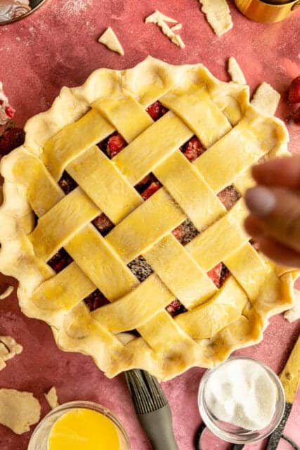 sprinkling sugar over the lattice top