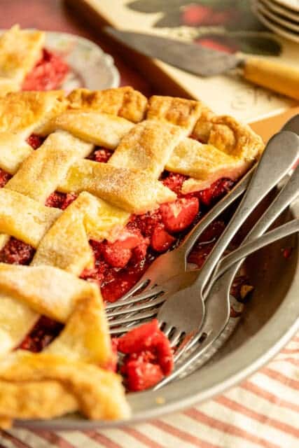 a strawberry pie with a piece taken out