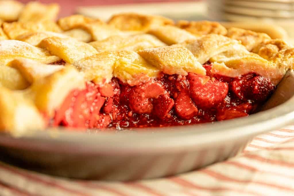close up of a fruit filled pie in a metal pie dish