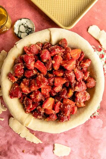 pie filled with strawberries inside a crust