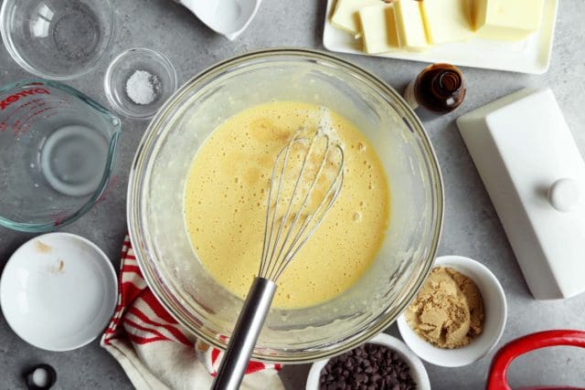 Dutch baby batter in a clear bowl