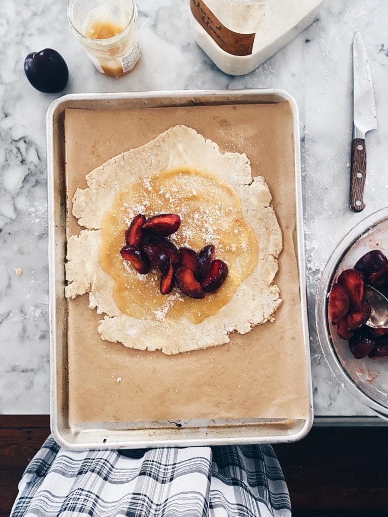 Assembling gluten-free plum galette