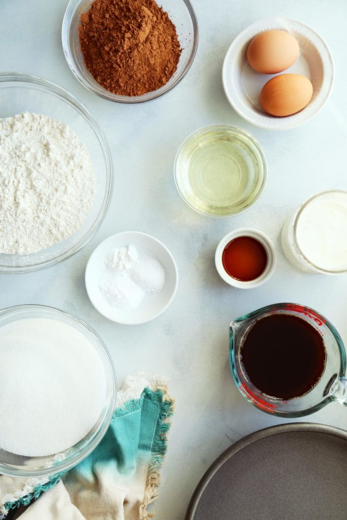 Ingredients in small bowls for chocolate birthday cake