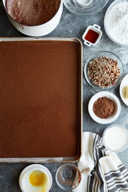Texas Sheet Cake batter in a pan ready to be baked.