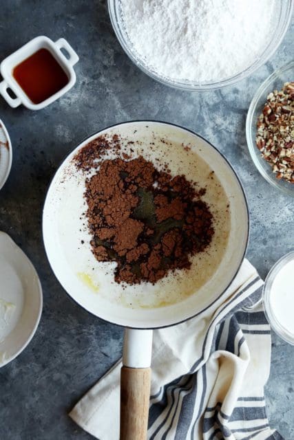 Cocoa powder in a pot with melted butter.