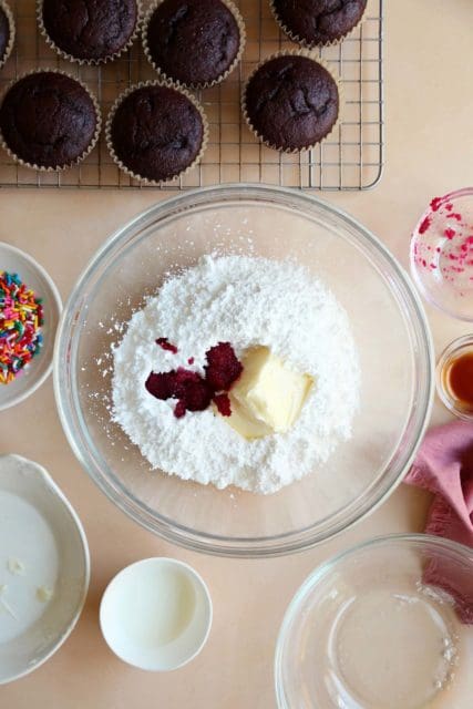 Ingredients for butter cream frosting in a bowl.