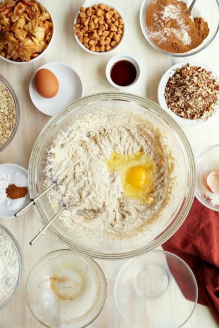 Creamed butter and sugar in a bowl with egg added for Browned Butter Oatmeal Apple Cookies
