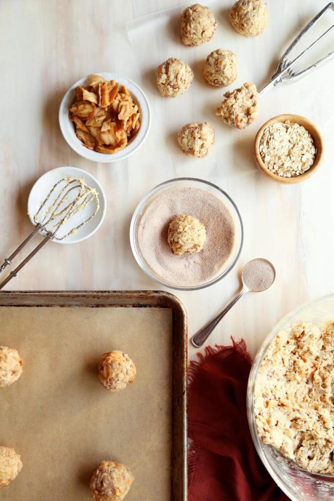 Cookie dough balls dipped in cinnamon sugar before baking.