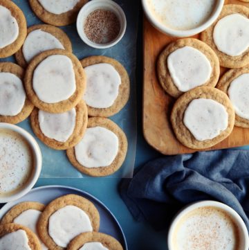 Taylor Swift cookie recipe scattered on a board with tea.