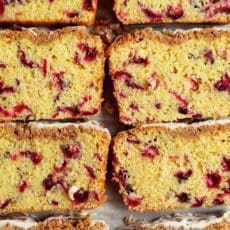Closeup of slice of cranberry orange bread.