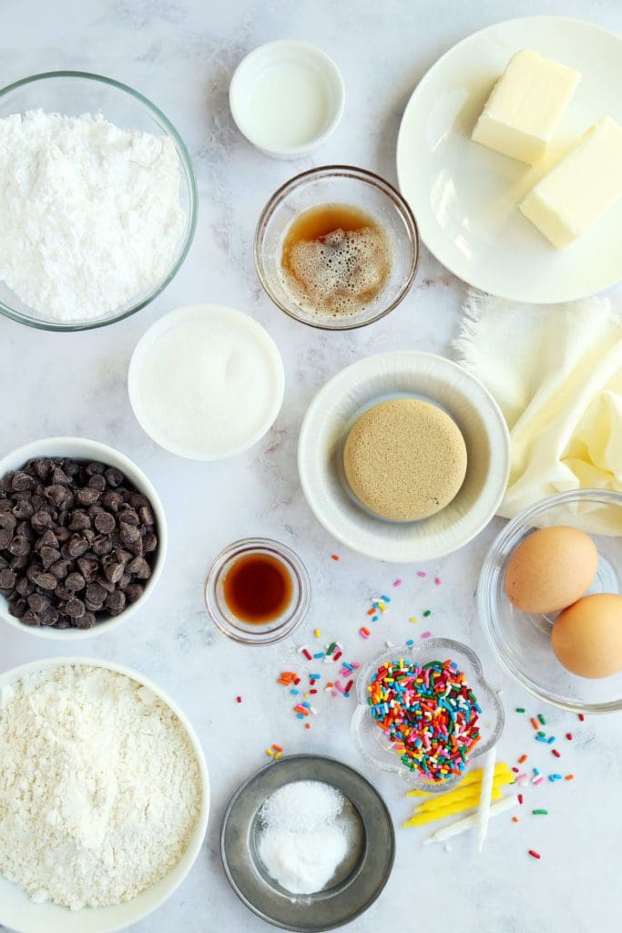 Ingredients for cookie cake recipe in small bowls ready to bake.
