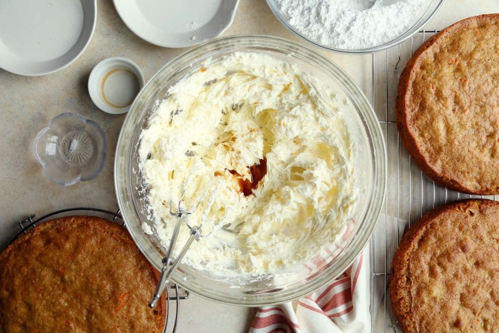 Vanilla extract added to butter and cream cheese mixture for cream cheese frosting.